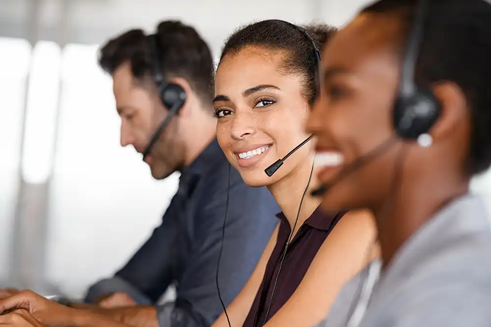 IT Staff with headphones answering calls 